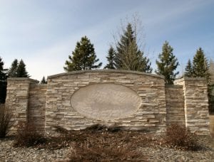 a well-marked and visible stone sign